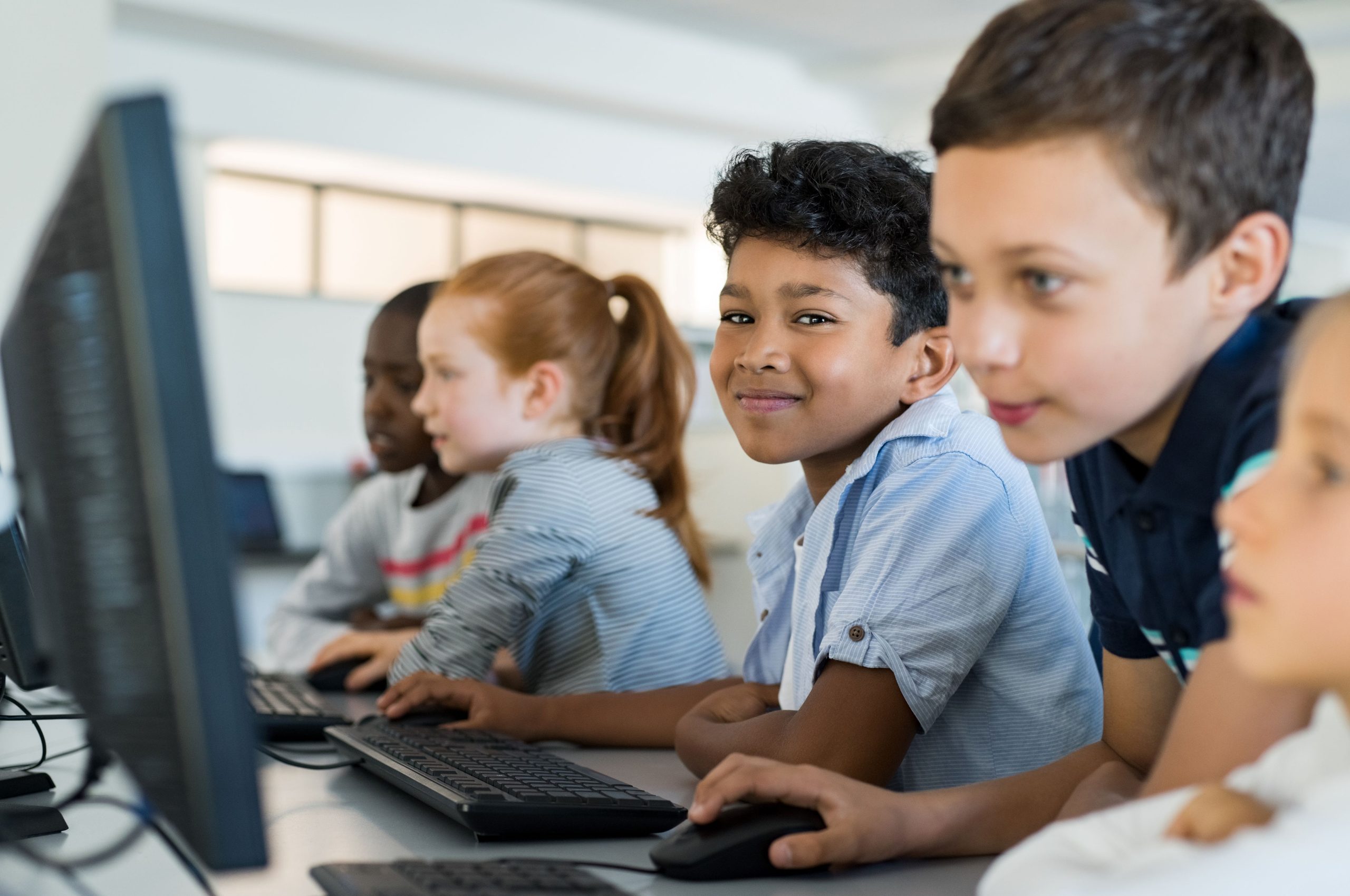 Pairs of students working at computers
